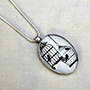 Bird cage cabochon pendant on a snake chain